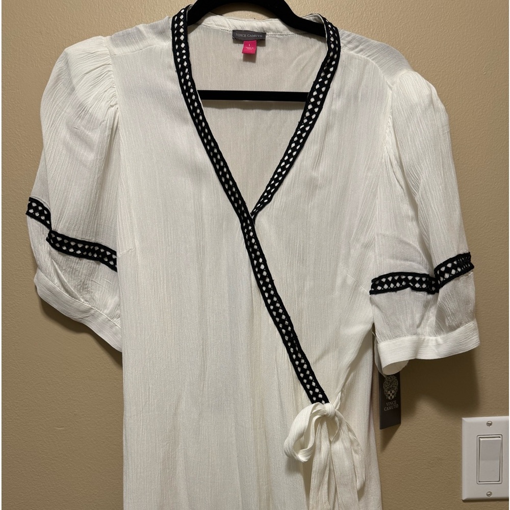 Cream colored Blouse short sleeve with one snap up at chest area size